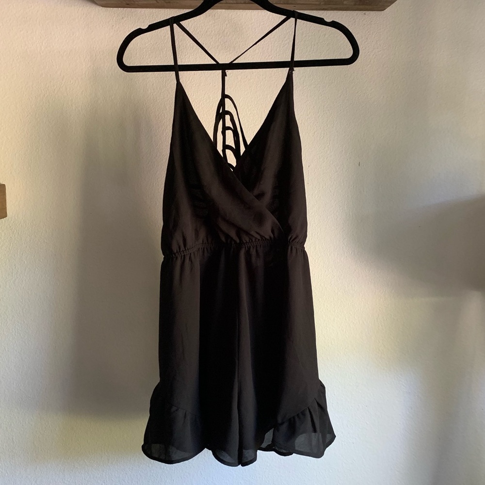 Sexy strappy back romper with ruffles in black